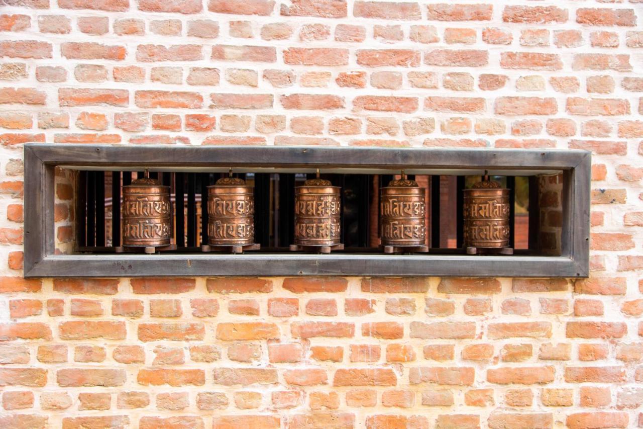 Basera Boutique Hotel Katmandu Eksteriør bilde Prayer wheels at the temple